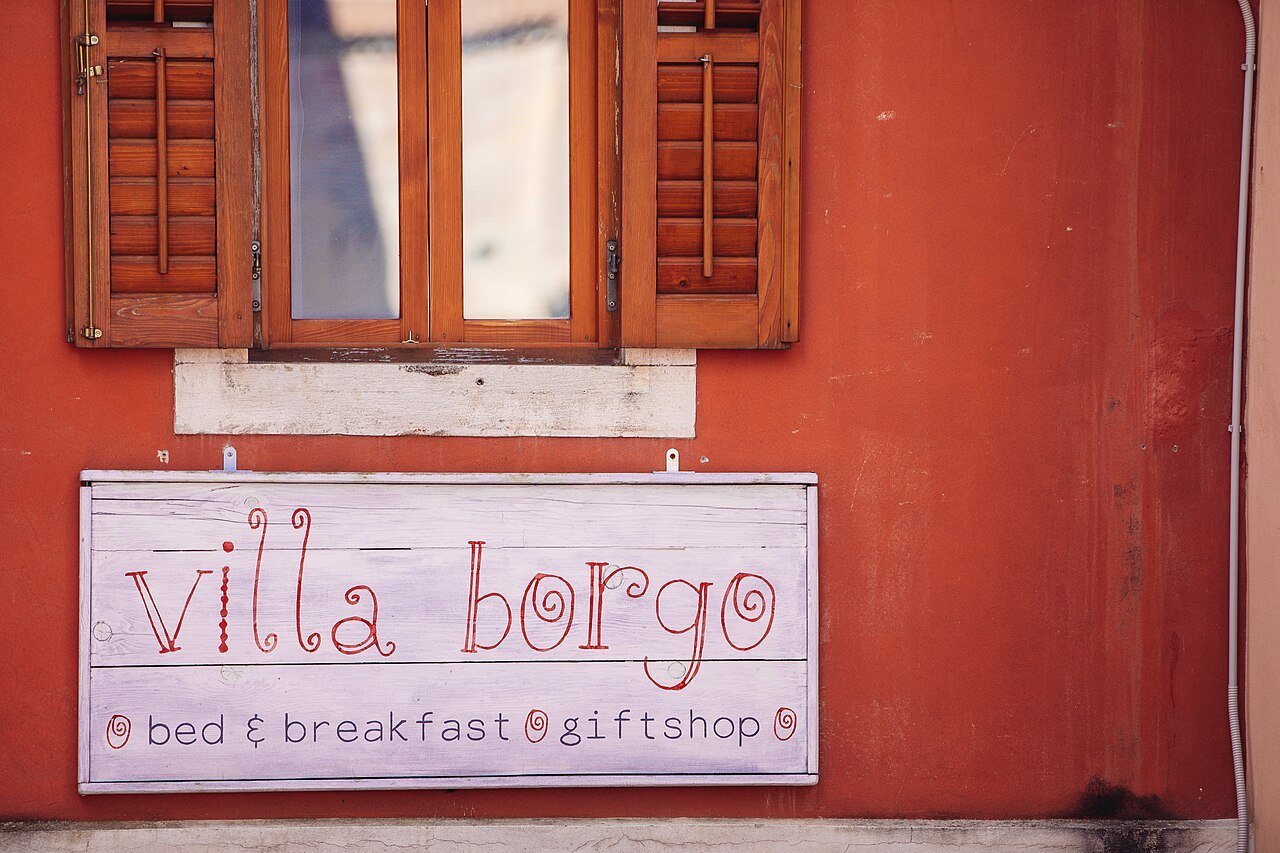 Villa Borgo’s sign and facade, photographed in 2023.